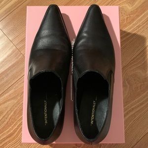 Pointed black leather booties